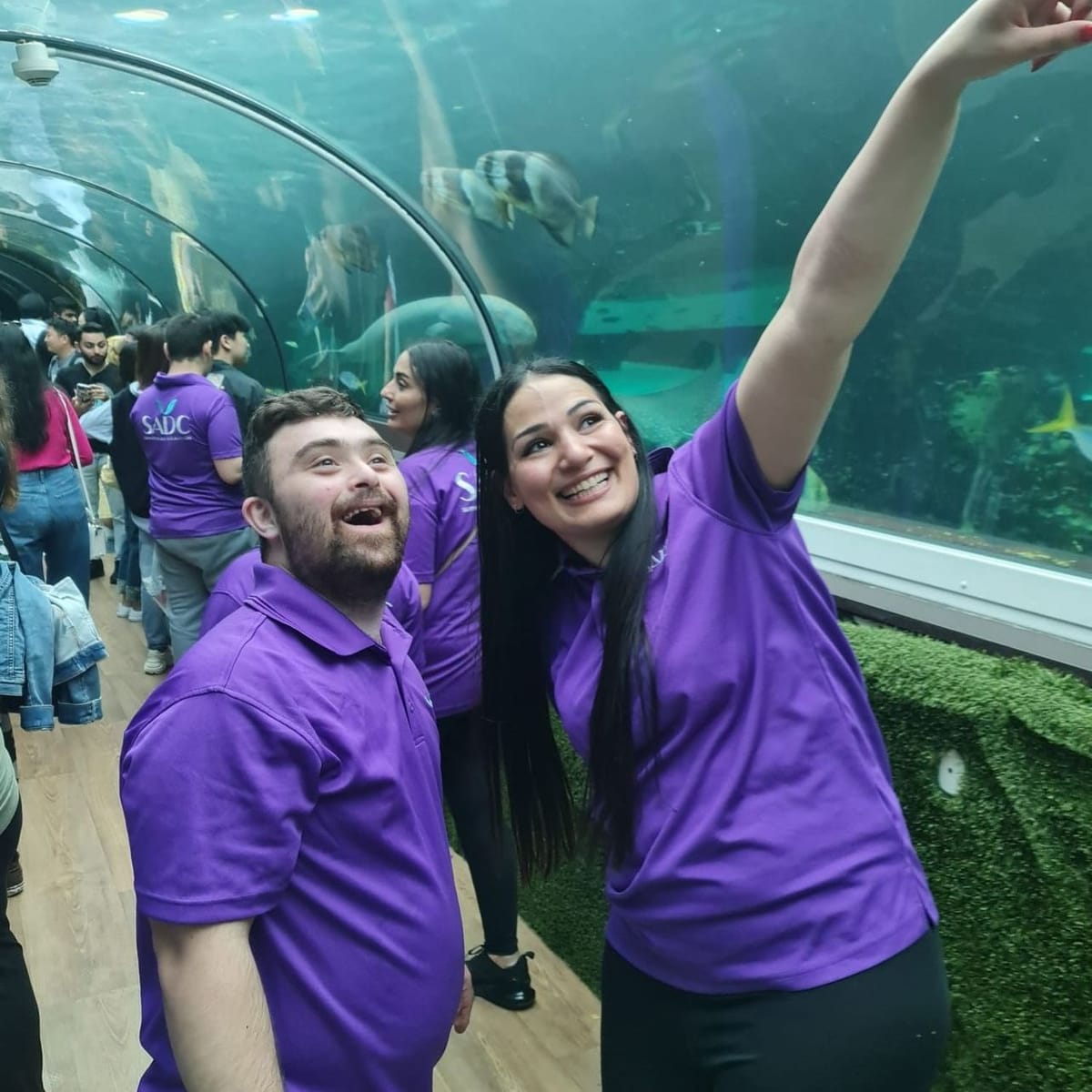 SADC support workers and a participant at the aquarium