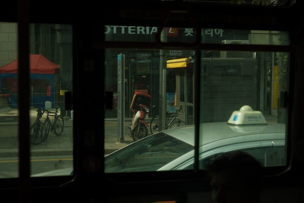 a view of a city street from a bus window - senior ride transportation in Sydney